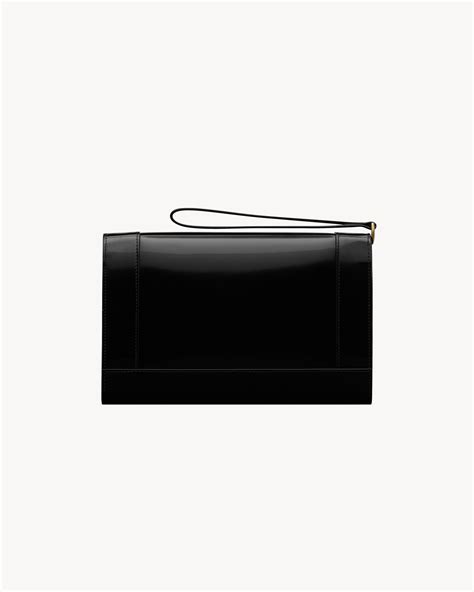 CASSANDRE flap pouch in shiny leather 